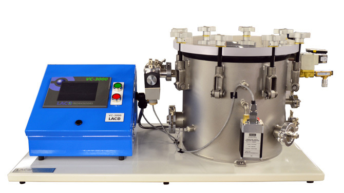 Front view of tabletop mounted vacuum and pressure system with vertical cylindrical chamber and vacuum contoller